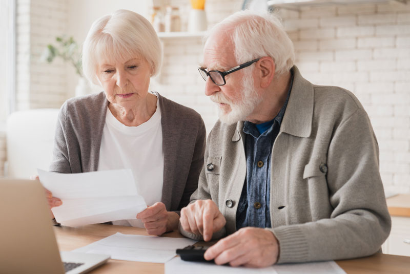 older couple discussing financing options together