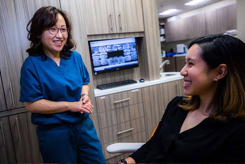 Dr. Jean Li with her patient during a dental implants consultation